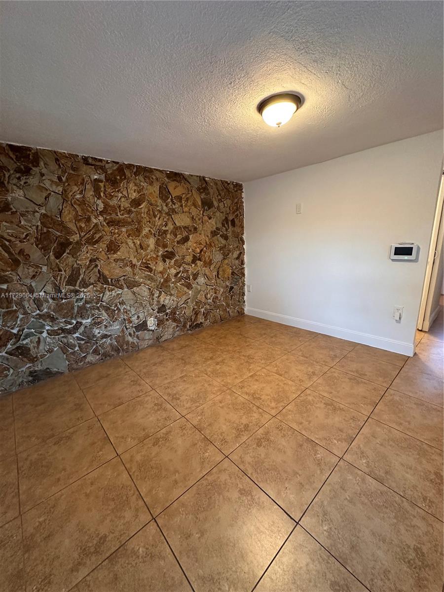 6131 Southwest 39th Street, Unit EAST Miramar, FL 33023 - Photo 3 of 15 a view of an empty room and window