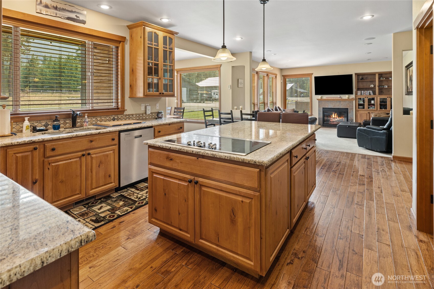190 Revelstoke Road Cle Elum, WA 98922 - Photo 12 of 39 a kitchen with stainless steel appliances granite countertop a sink a stove and a wooden floors