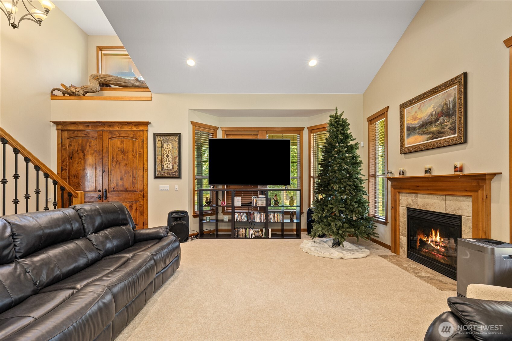 190 Revelstoke Road Cle Elum, WA 98922 - Photo 15 of 39 a living room with furniture a flat screen tv and a fireplace