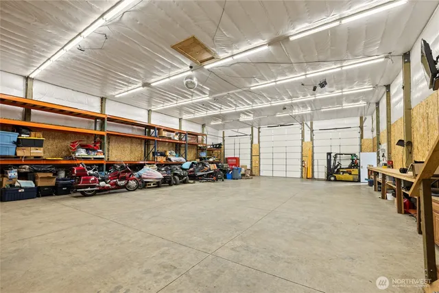 a view of parking garage with cars
