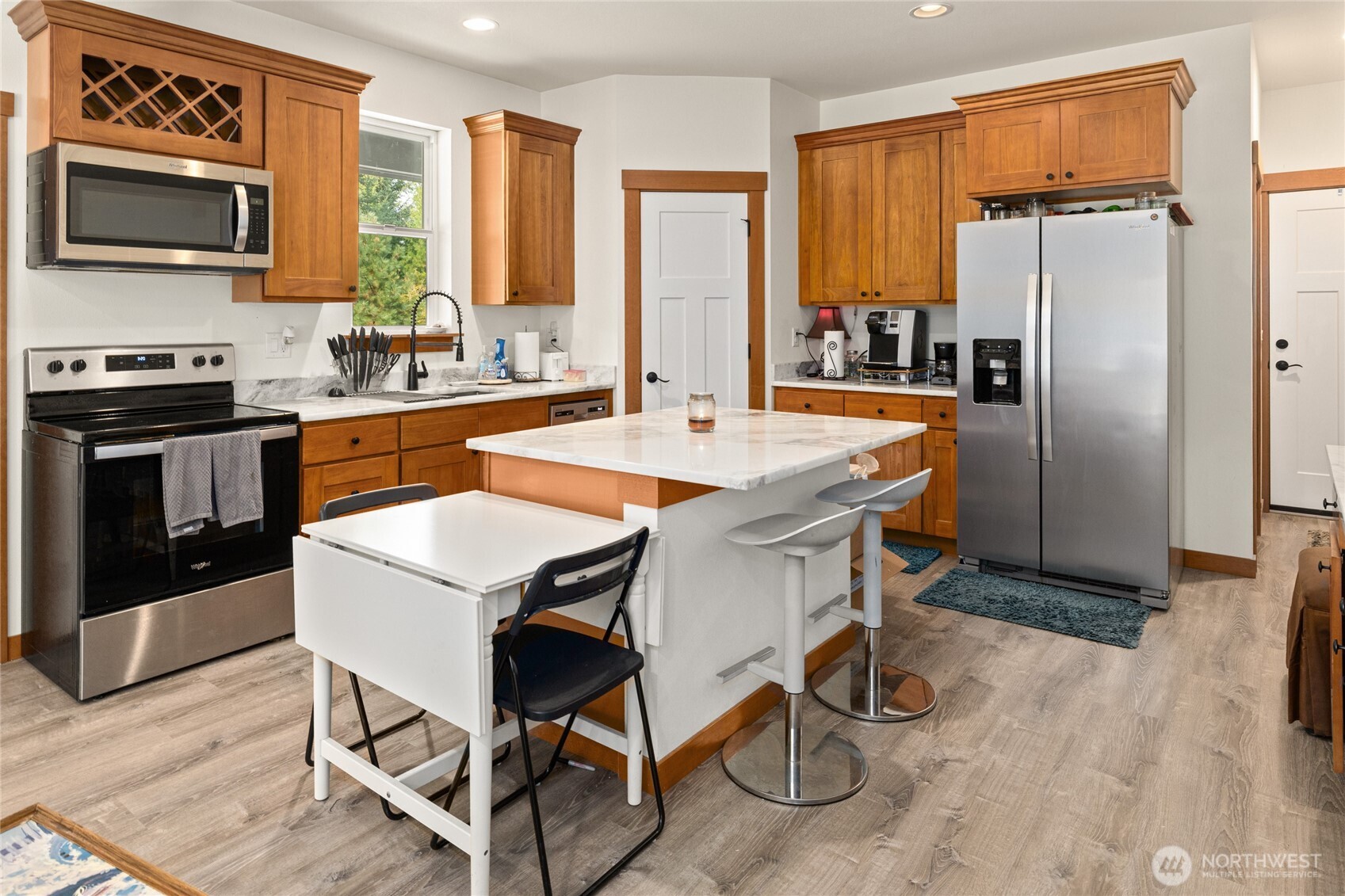 190 Revelstoke Road Cle Elum, WA 98922 - Photo 34 of 39 a kitchen with stainless steel appliances granite countertop a stove a refrigerator a microwave a sink and cabinets