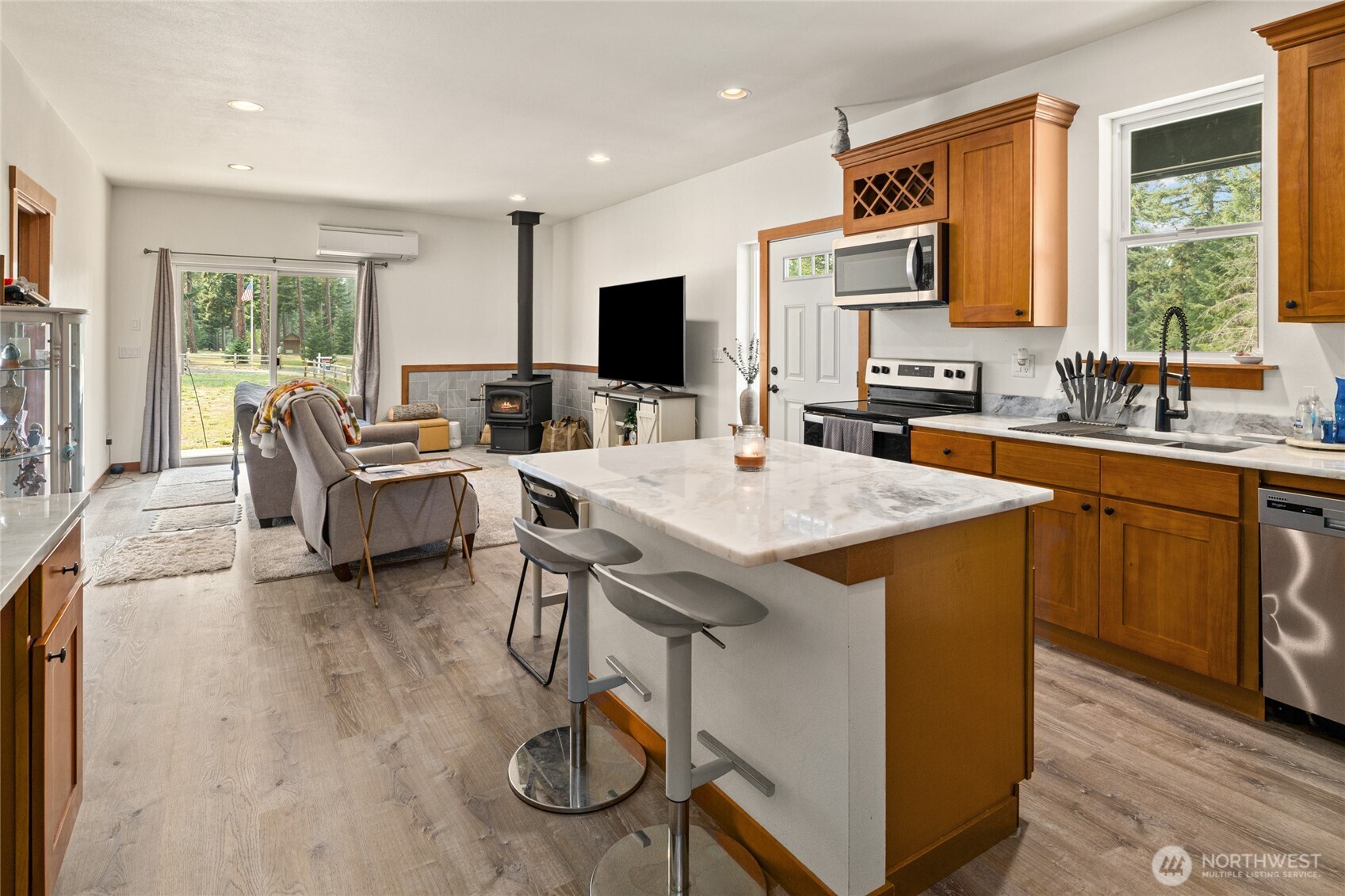 190 Revelstoke Road Cle Elum, WA 98922 - Photo 35 of 39 a living room with furniture a flat screen tv and a large window
