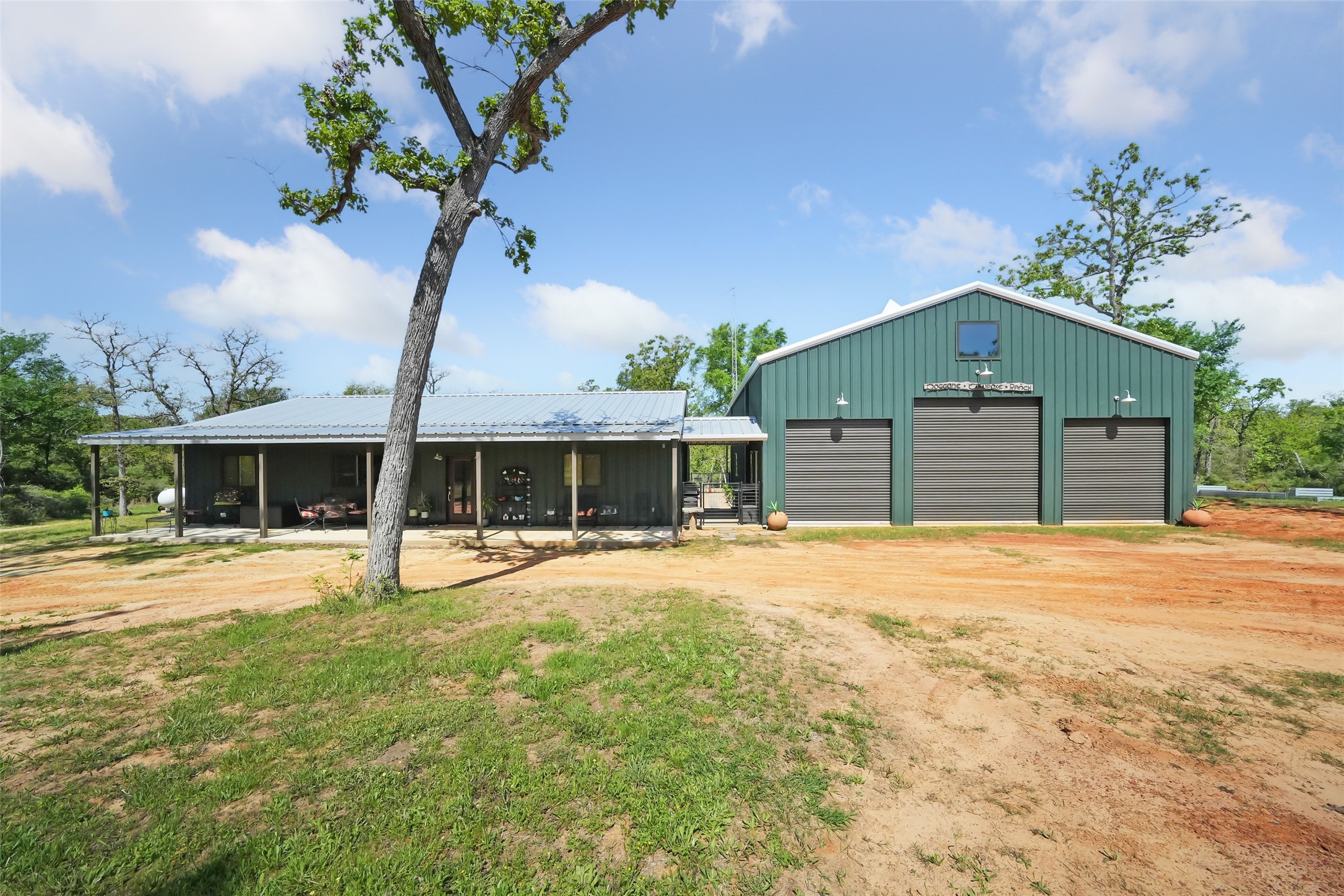 4924 County Road 4263 Marquez, TX 77865 - Photo 2 of 50 a front view of a house with a yard and garage