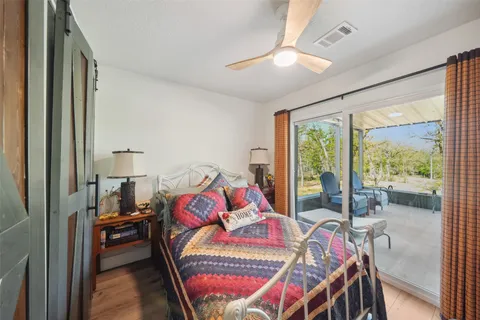 a bedroom with furniture and a window