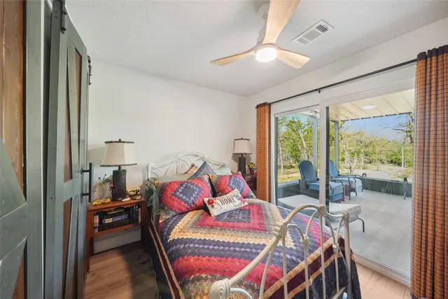 a bedroom with furniture and a window