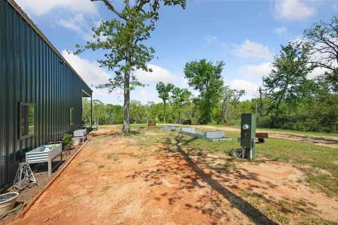 a view of a backyard with garden