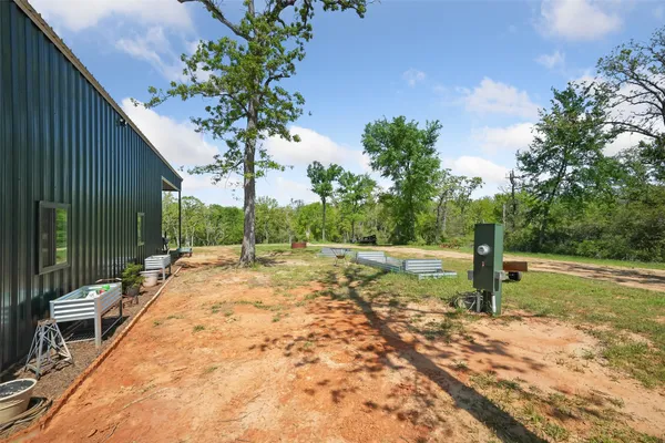 a view of a backyard with garden
