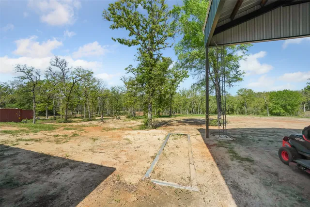 a view of a backyard of a house