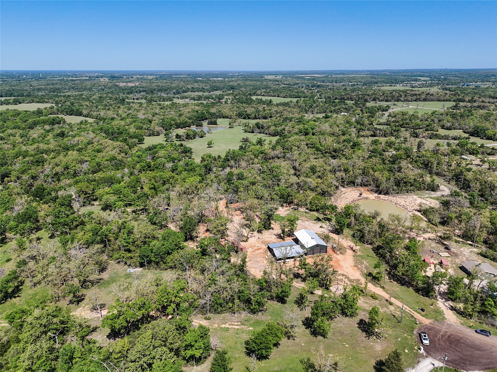 4924 County Road 4263 Marquez, TX 77865 - Photo 49 of 50 an aerial view of residential houses with outdoor space and trees