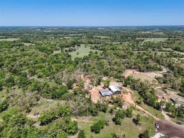 a view of a backyard with sitting area