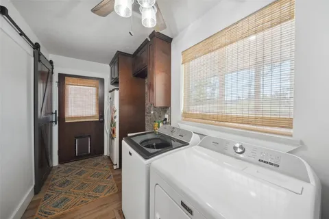 a room with a bed and a chandelier