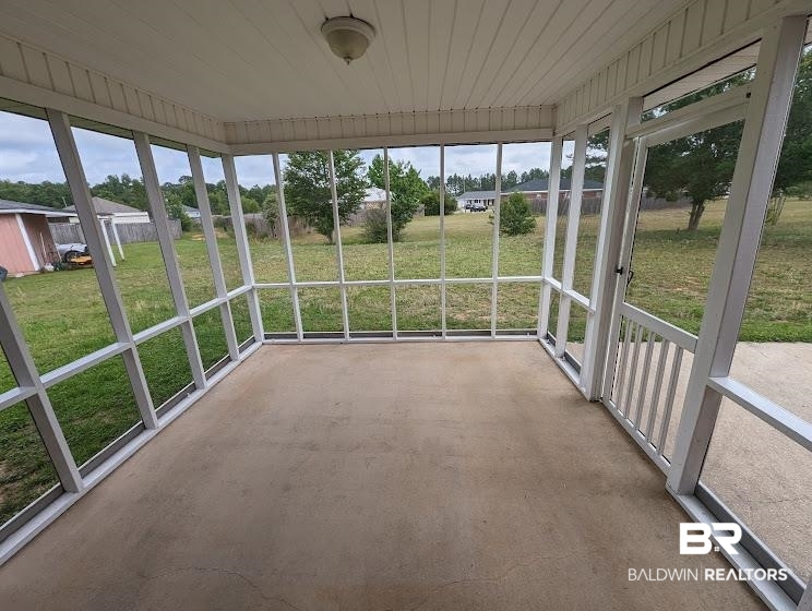 12971 Labradors Run Foley, AL 36535 - Photo 23 of 23 Spacious screened porch featuring a concrete floor, white frame construction, and a beadboard ceiling