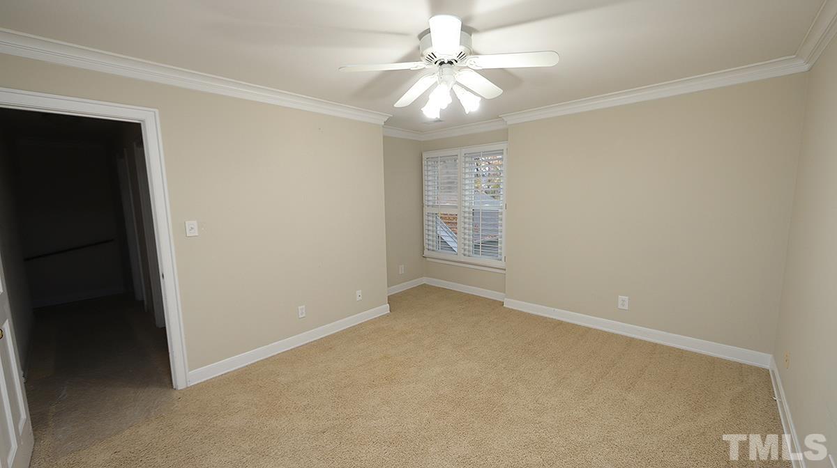2203 Landings Way Raleigh, NC 27615 - Photo 17 of 22 an empty room with windows and fan