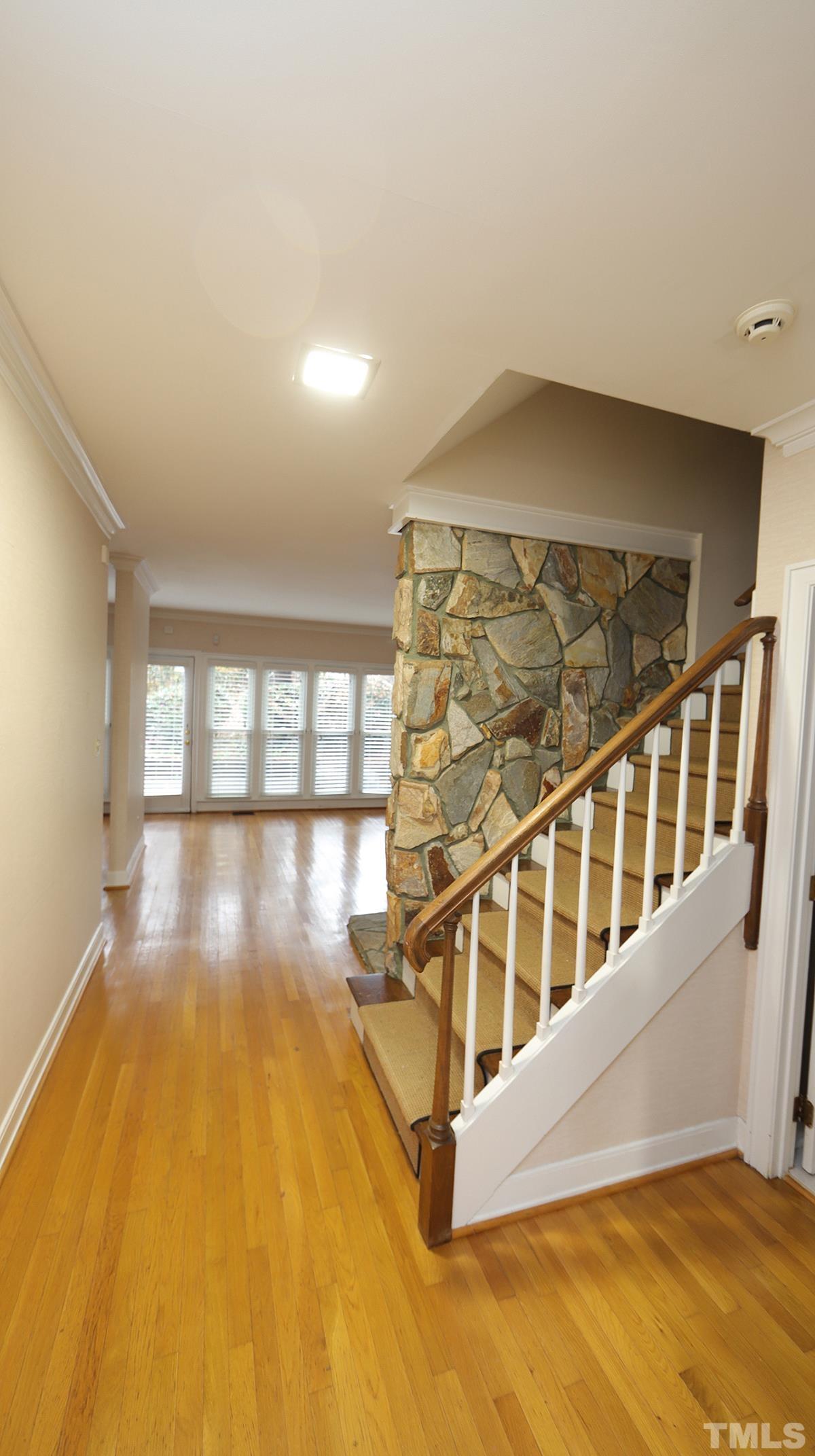 2203 Landings Way Raleigh, NC 27615 - Photo 4 of 22 view of an empty room with wooden floor and a window