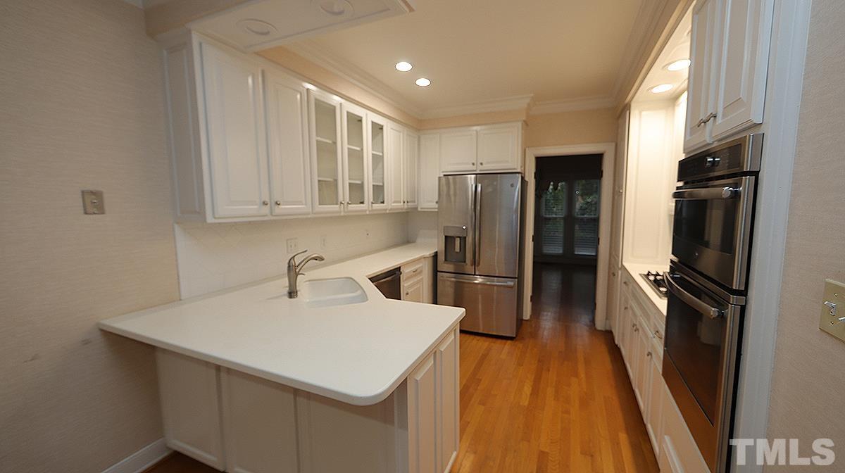 2203 Landings Way Raleigh, NC 27615 - Photo 6 of 22 a kitchen with a refrigerator a sink and dishwasher