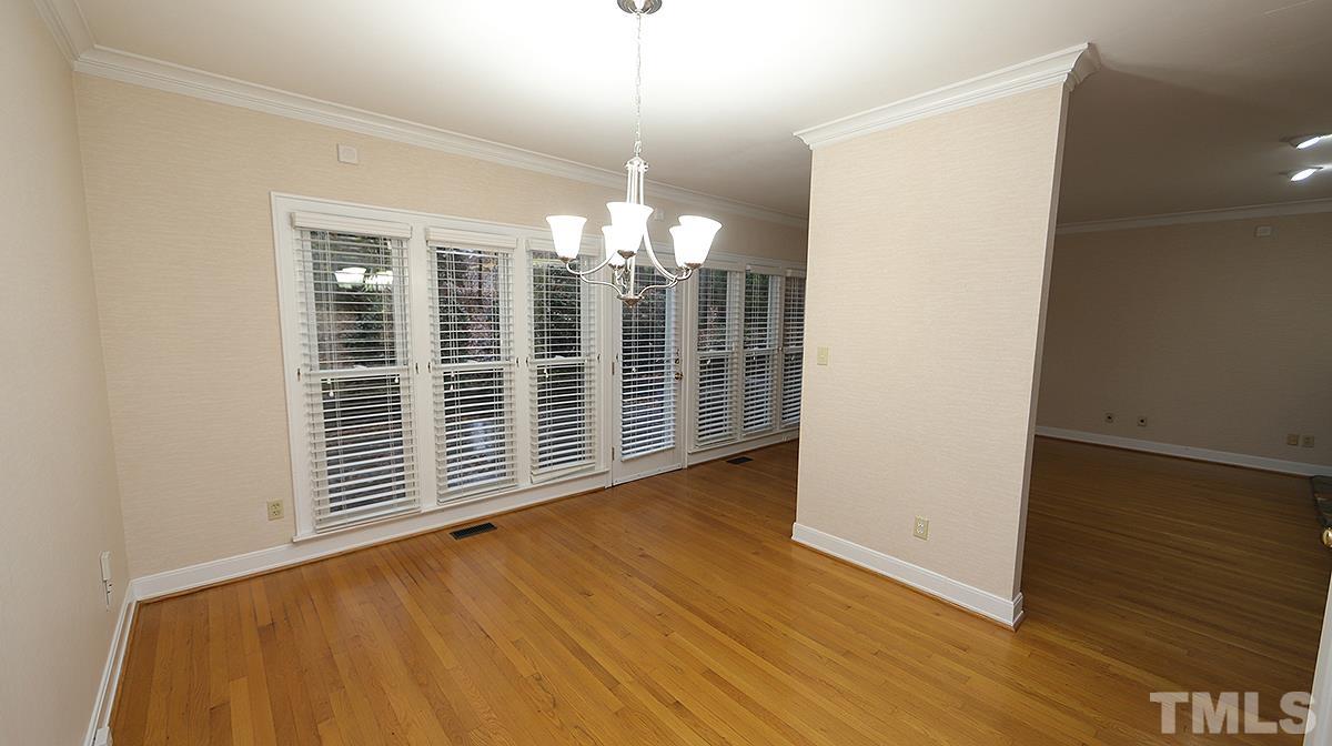 2203 Landings Way Raleigh, NC 27615 - Photo 8 of 22 a view of a room with wooden floor and chandelier