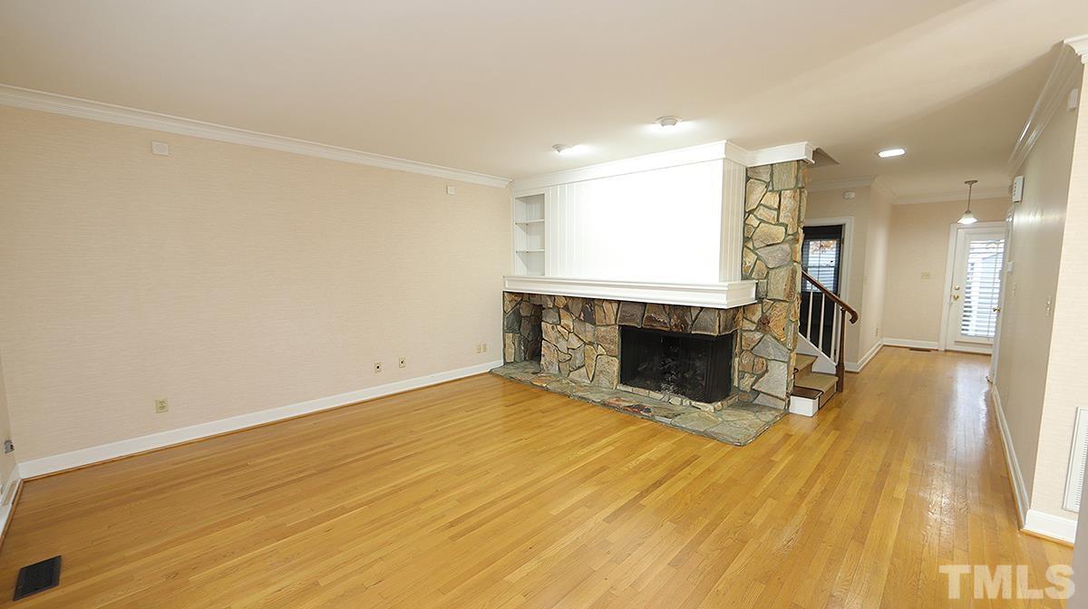 2203 Landings Way Raleigh, NC 27615 - Photo 9 of 22 a view of a livingroom with a fireplace