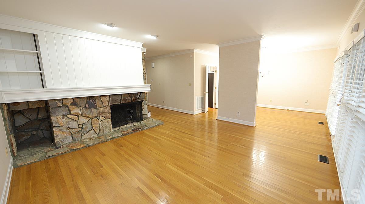 2203 Landings Way Raleigh, NC 27615 - Photo 10 of 22 a view of an empty room with wooden floor