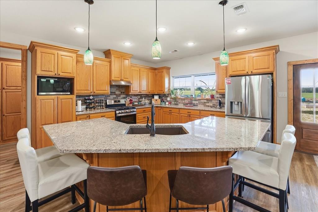 971 Bamboo Road Big Sandy, TX 75755 - Photo 13 of 40 a dining table with chairs and view of living room