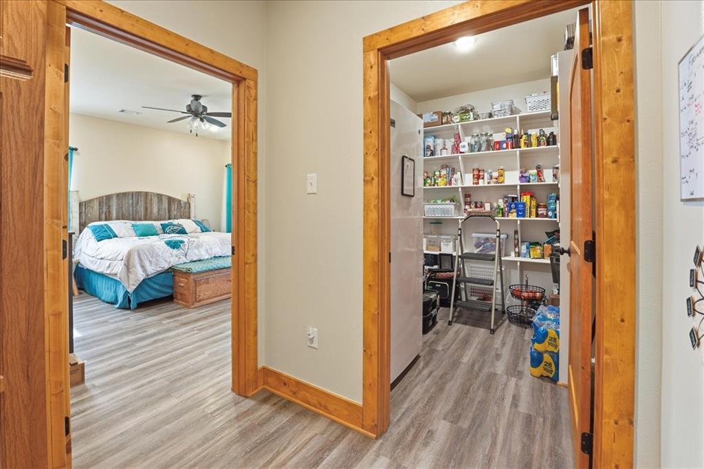 971 Bamboo Road Big Sandy, TX 75755 - Photo 17 of 40 a bedroom with furniture and a wooden floor