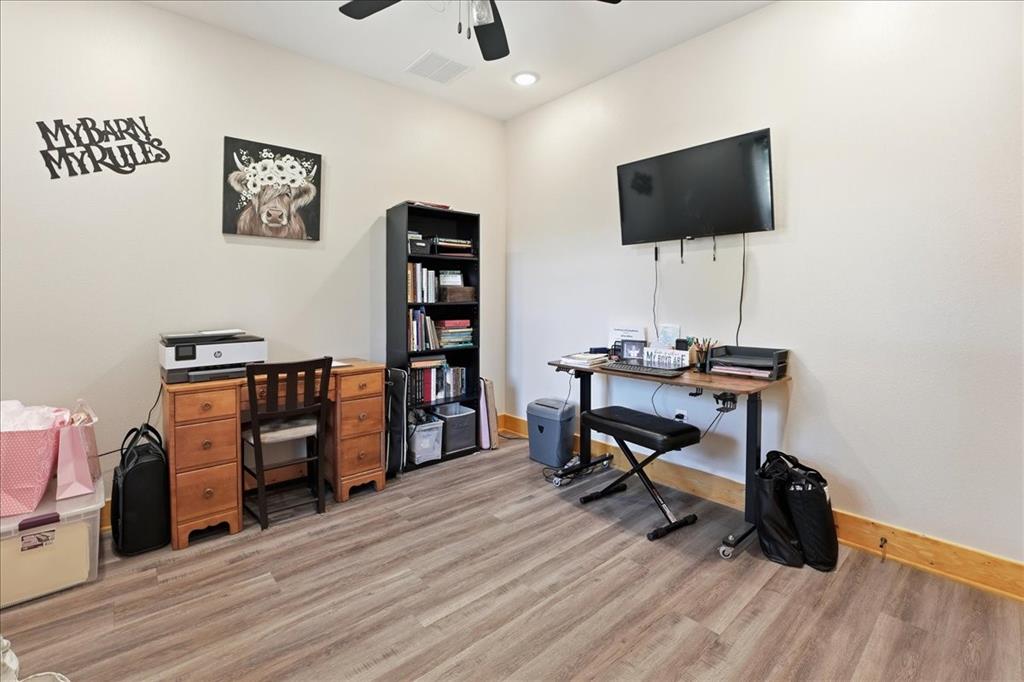 971 Bamboo Road Big Sandy, TX 75755 - Photo 22 of 40 a view of a workspace with furniture and wooden floor