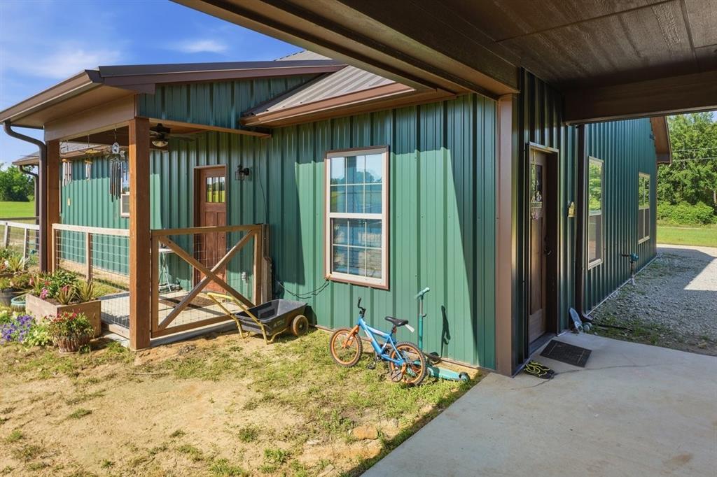 971 Bamboo Road Big Sandy, TX 75755 - Photo 26 of 40 a view of a backyard with a table and chairs
