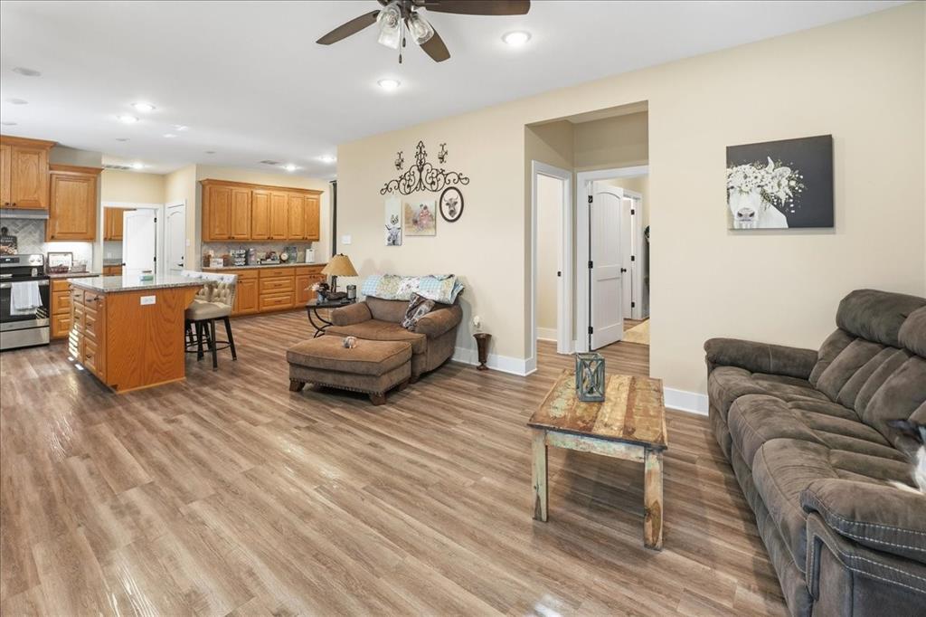 971 Bamboo Road Big Sandy, TX 75755 - Photo 27 of 40 a living room with furniture and a wooden floor