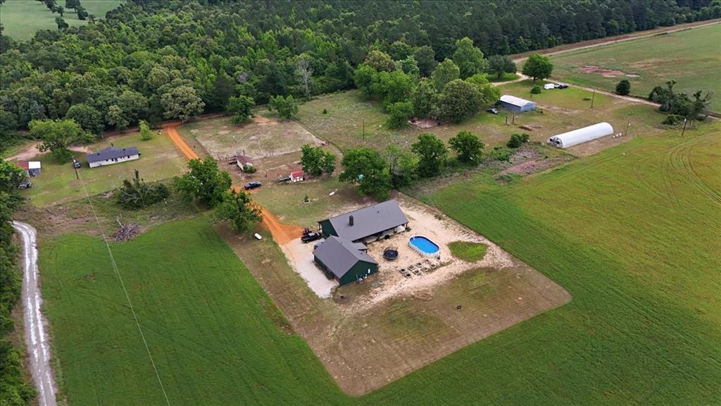 971 Bamboo Road Big Sandy, TX 75755 - Photo 3 of 40 an aerial view of a house a yard basket ball court and outdoor seating