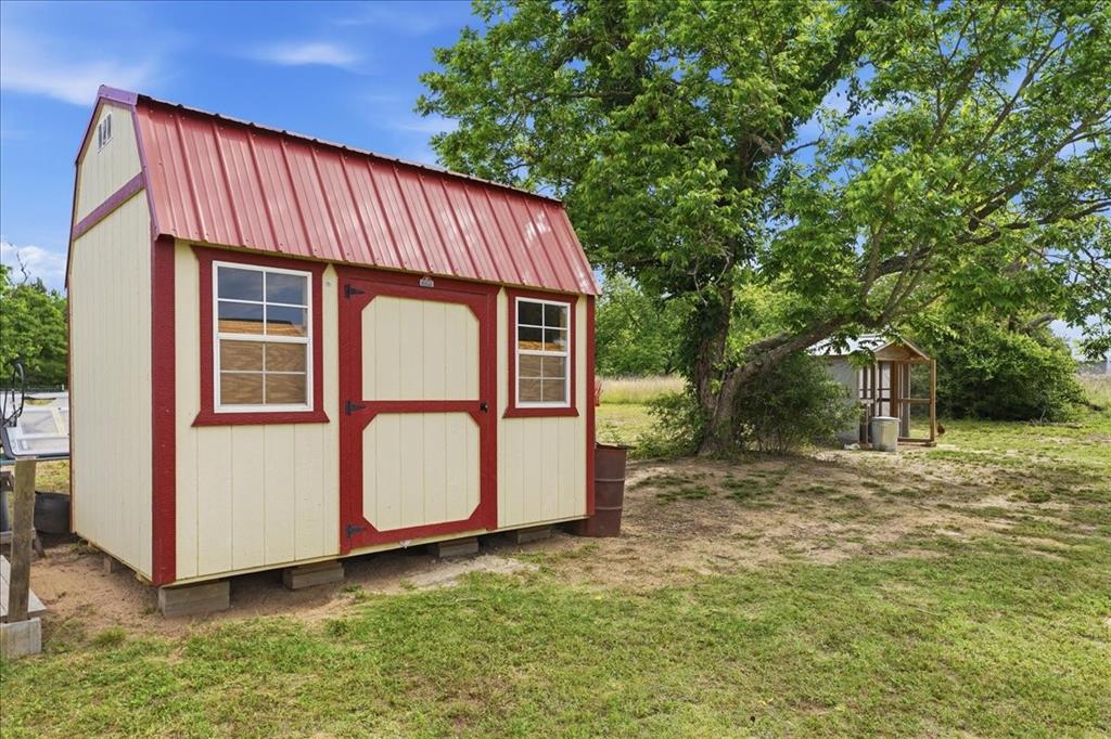 971 Bamboo Road Big Sandy, TX 75755 - Photo 8 of 40 a front view of a house with a yard