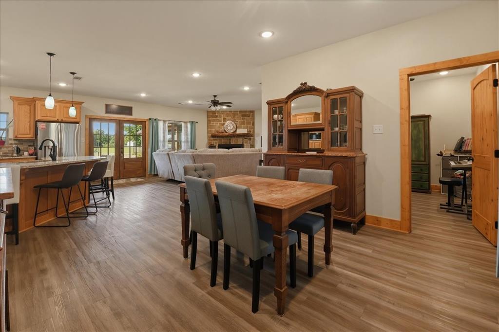 971 Bamboo Road Big Sandy, TX 75755 - Photo 9 of 40 a view of a dining room with furniture and wooden floor