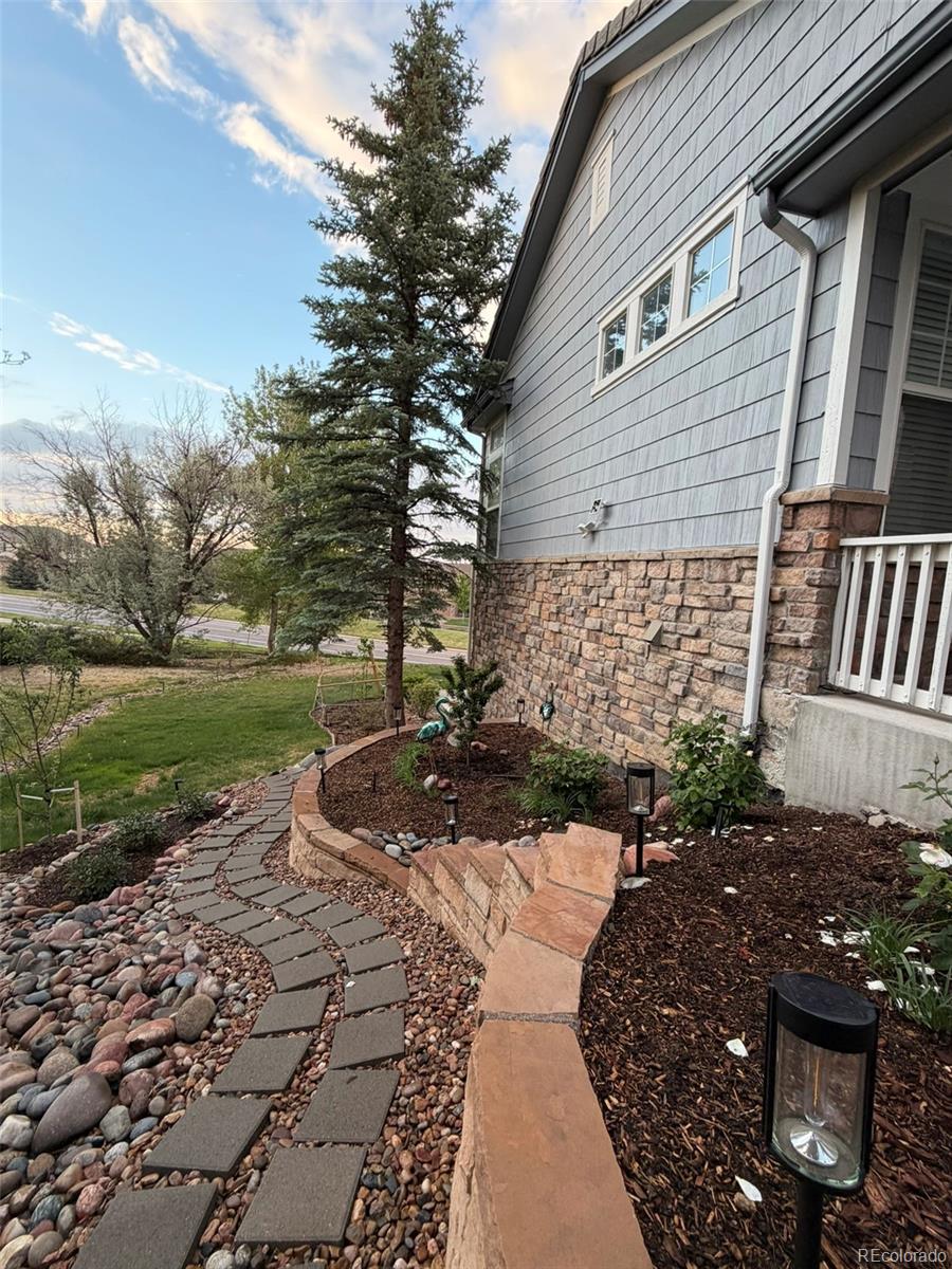 7242 South Rome Street Aurora, CO 80016 - Photo 30 of 33 a view of a backyard with pathway