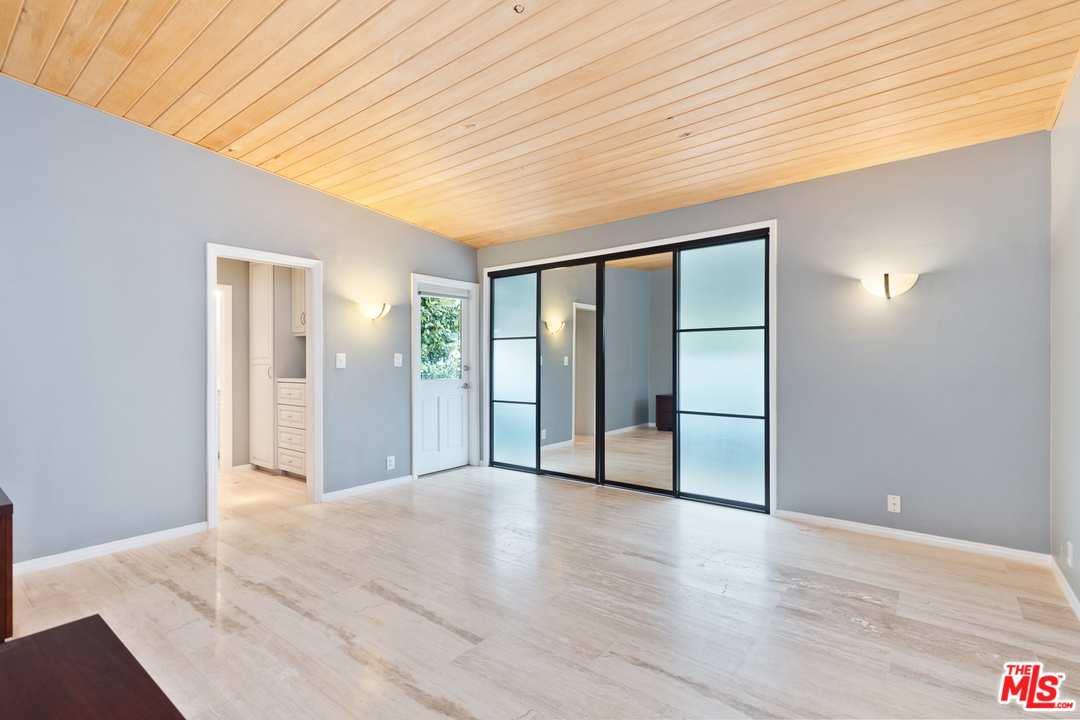 9614 Heather Road Beverly Hills, CA 90210 - Photo 12 of 26 a view of a livingroom with wooden floor
