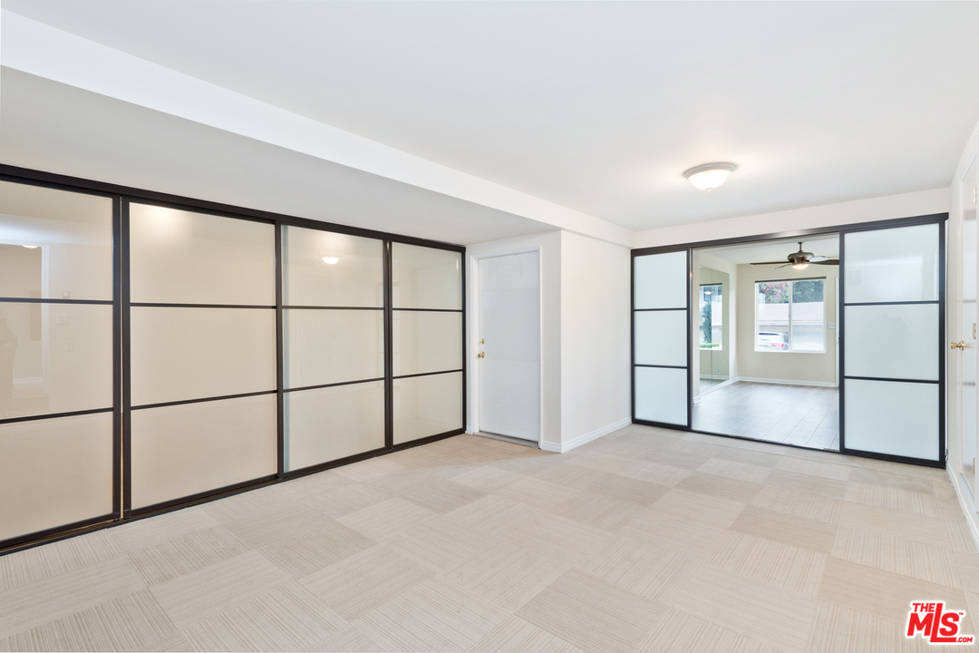 9614 Heather Road Beverly Hills, CA 90210 - Photo 17 of 26 a view of an empty room with a window