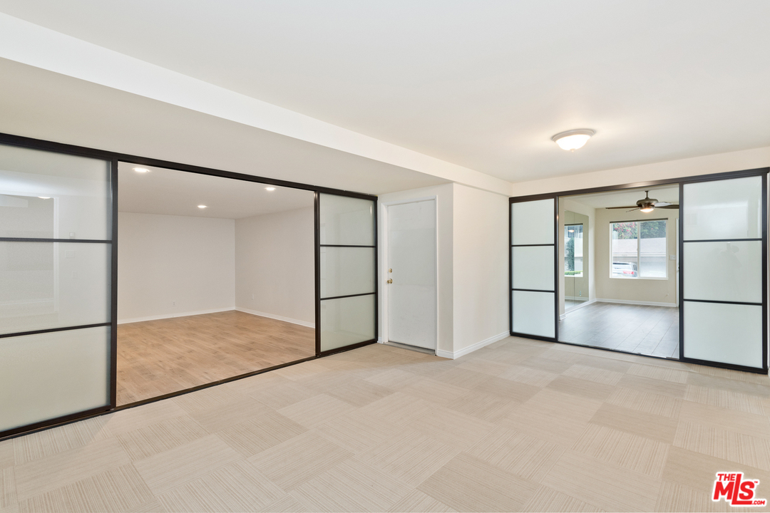 9614 Heather Road Beverly Hills, CA 90210 - Photo 20 of 26 a view of an empty room with cabinet and a refrigerator