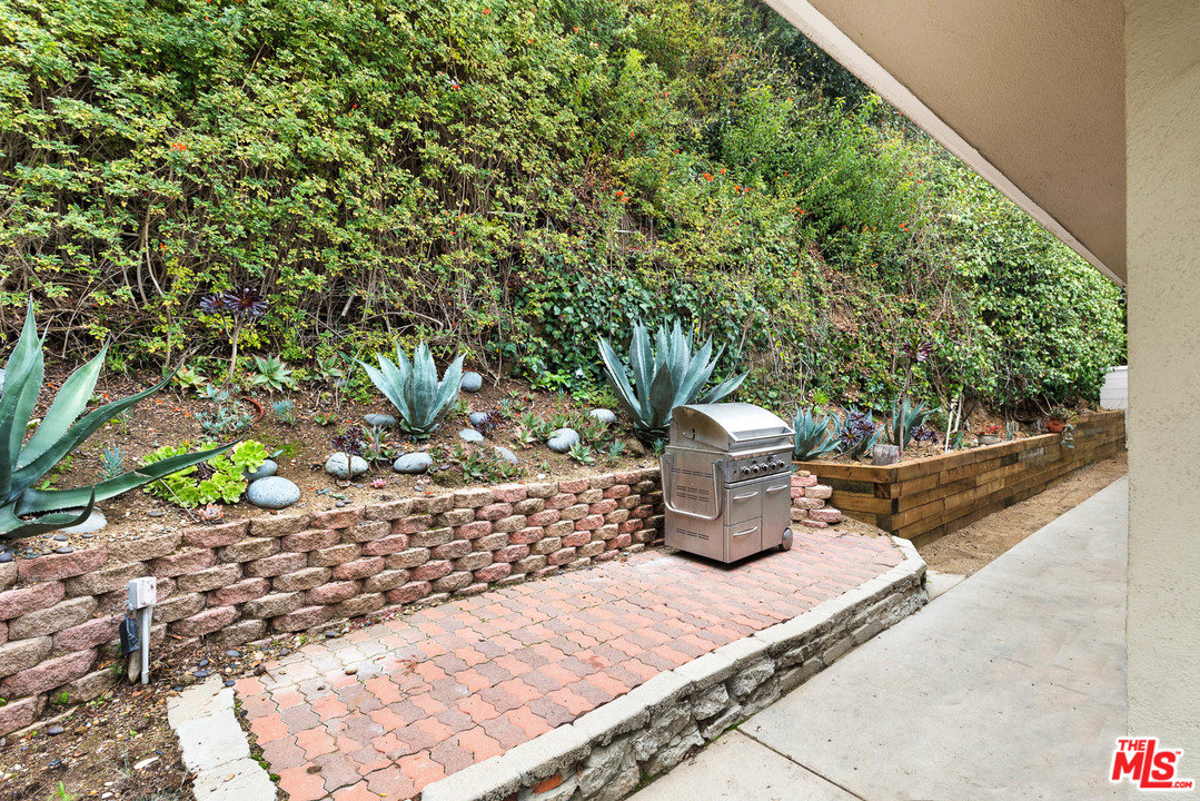 9614 Heather Road Beverly Hills, CA 90210 - Photo 23 of 26 a park view with a bench