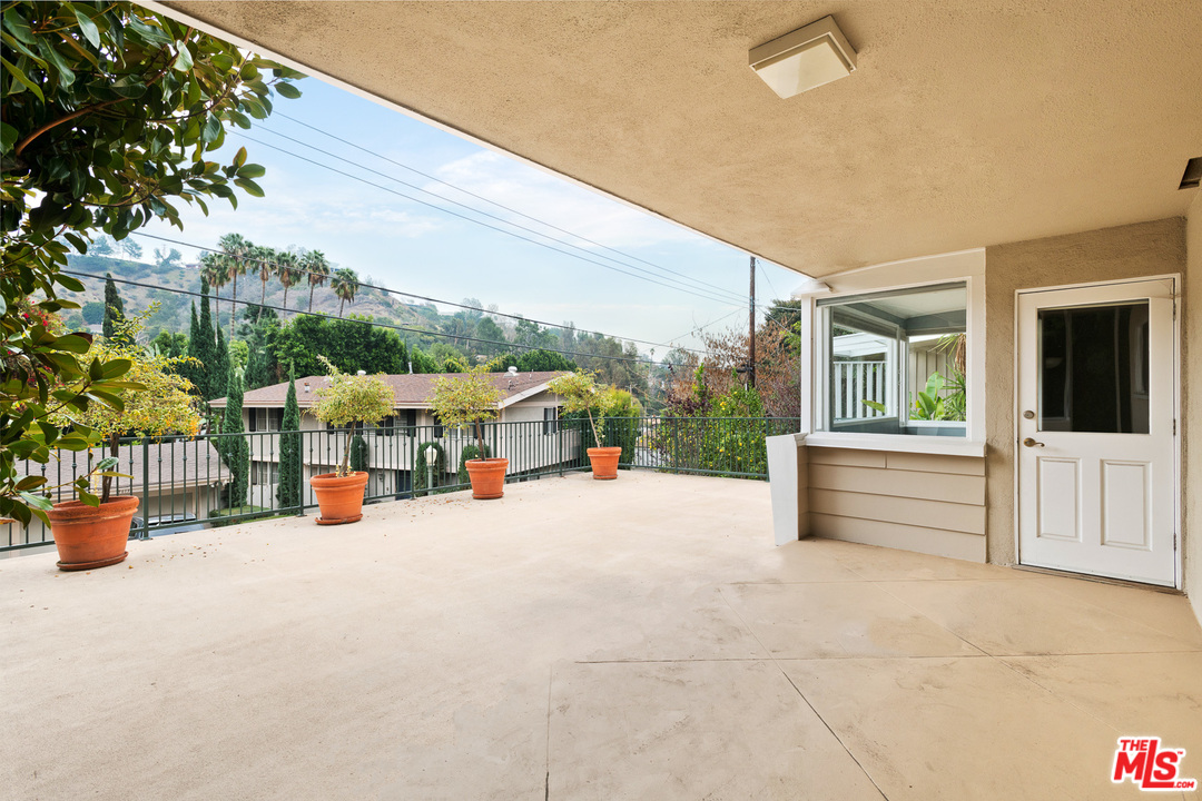 9614 Heather Road Beverly Hills, CA 90210 - Photo 25 of 26 a view of a terrace with seating space