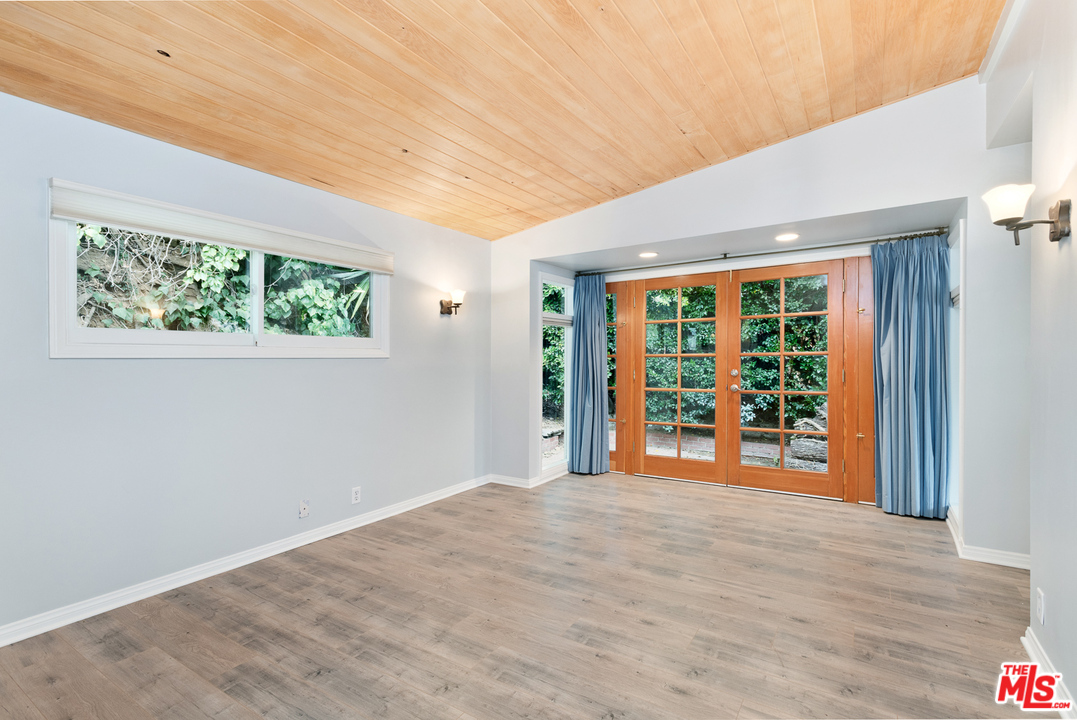 9614 Heather Road Beverly Hills, CA 90210 - Photo 9 of 26 a view of an empty room with a window
