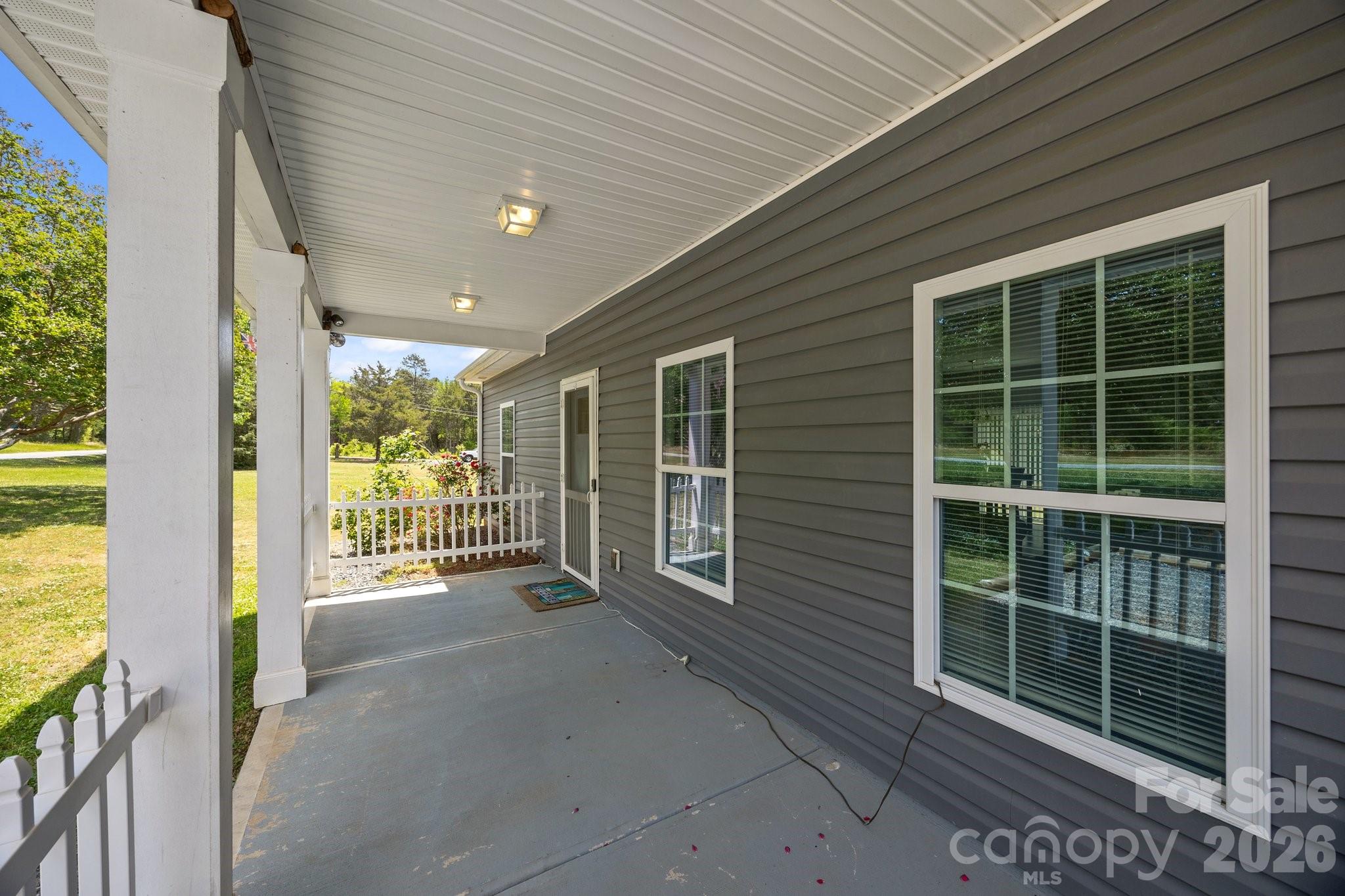 14532 East Rocky River Road Davidson, NC 28036 - Photo 7 of 32 a view of an empty room with a balcony