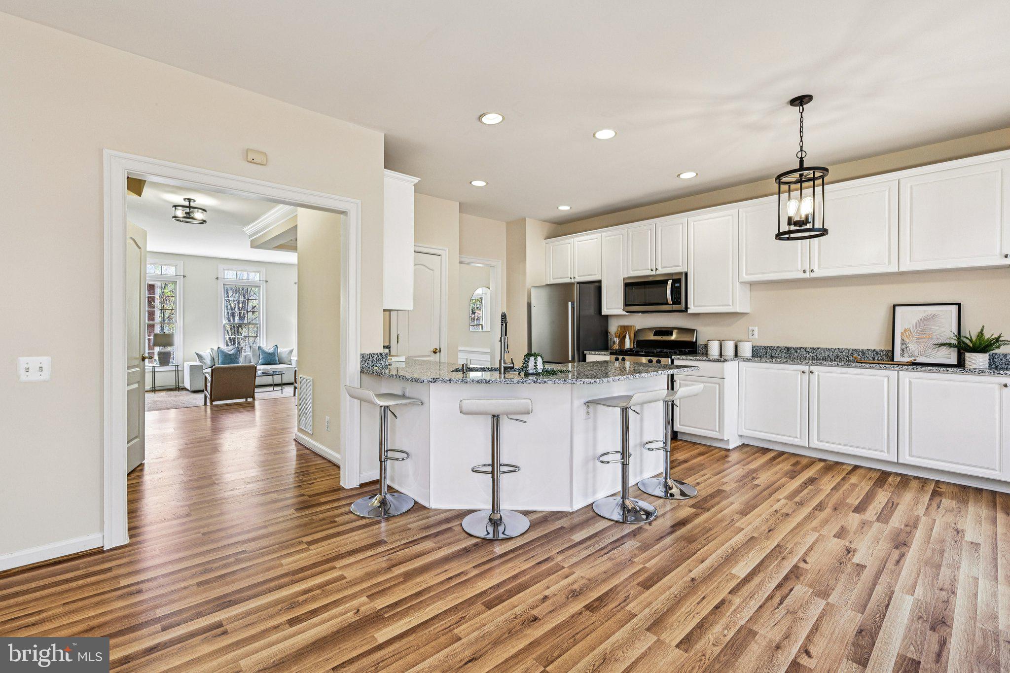 2746 Pembsly Drive Vienna, VA 22181 - Photo 12 of 46 a kitchen with white cabinets and stainless steel appliances