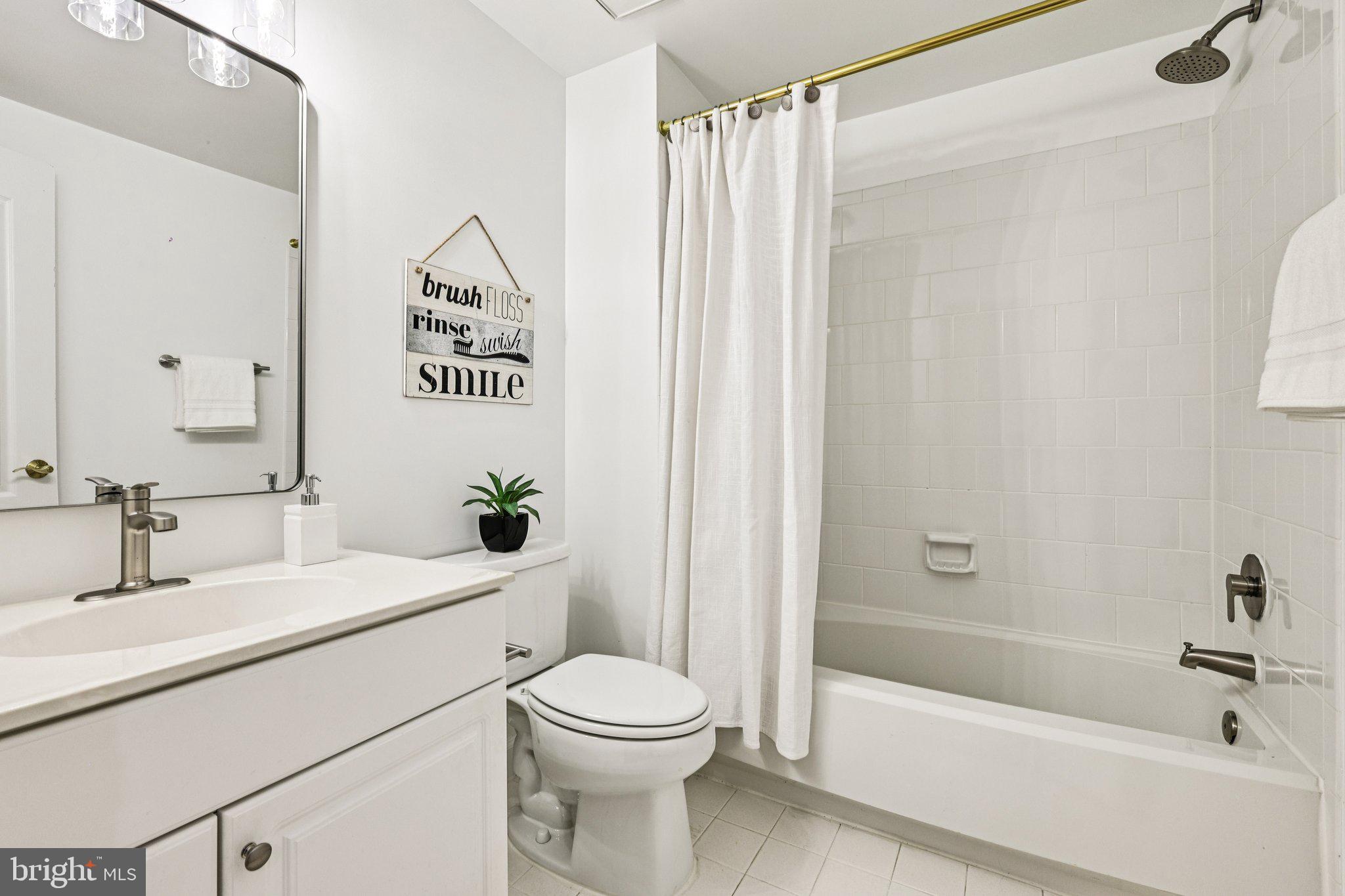 2746 Pembsly Drive Vienna, VA 22181 - Photo 17 of 46 a bathroom with a sink a toilet and shower