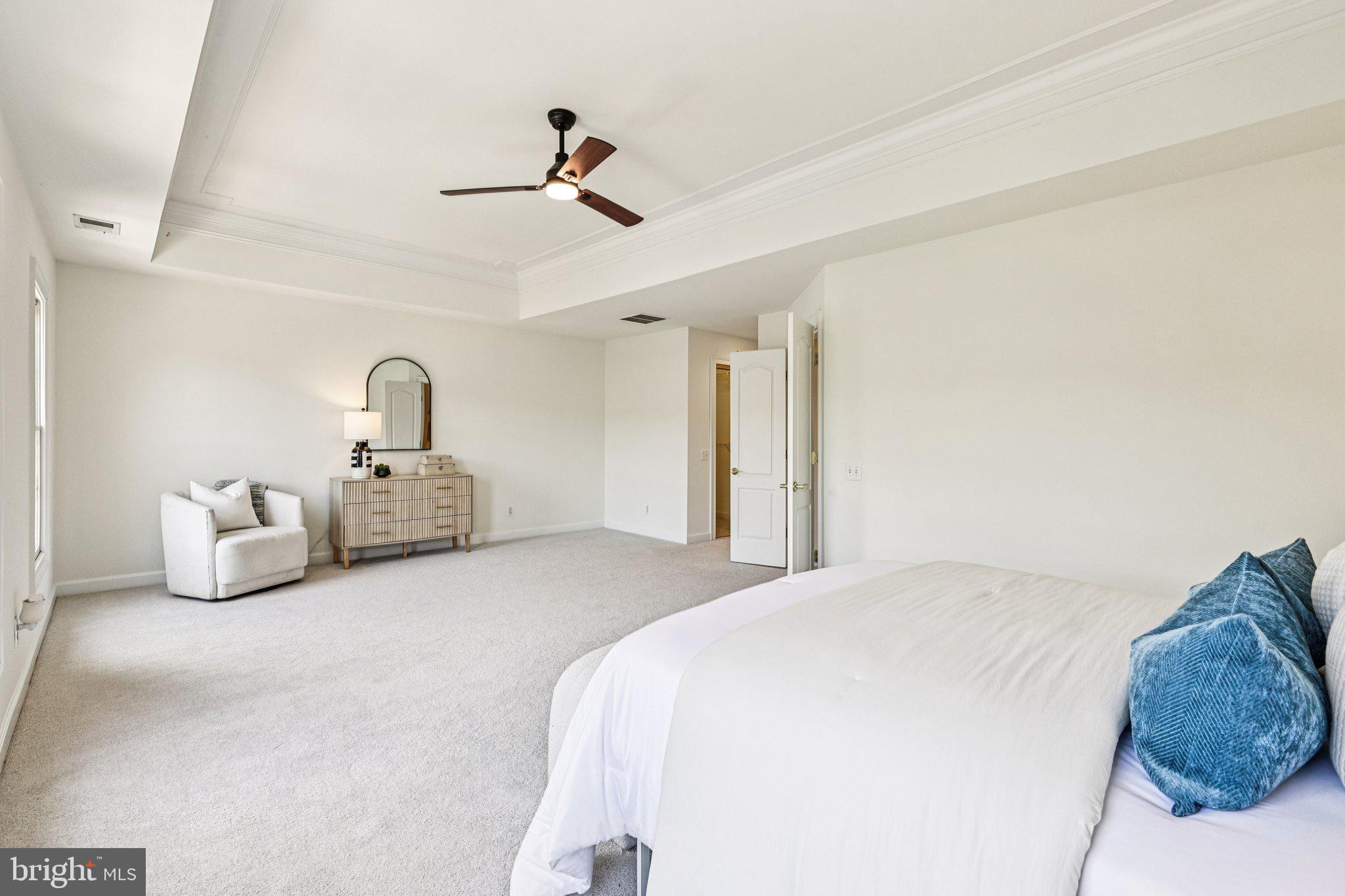 2746 Pembsly Drive Vienna, VA 22181 - Photo 19 of 46 a spacious bedroom with a bed and ceiling fan