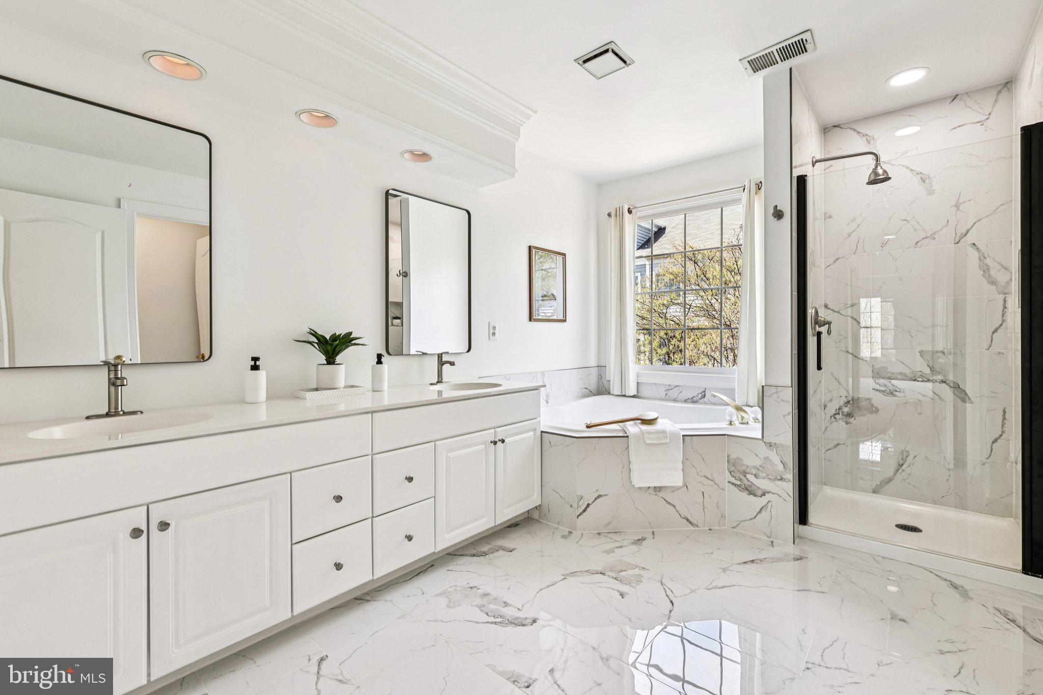 2746 Pembsly Drive Vienna, VA 22181 - Photo 20 of 46 a bathroom with a double vanity sink toilet and shower