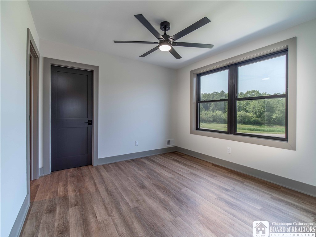 3034 Mandolin Rdg Way Chautauqua, NY 14757 - Photo 23 of 31 The third bedroom on the second floor features a c