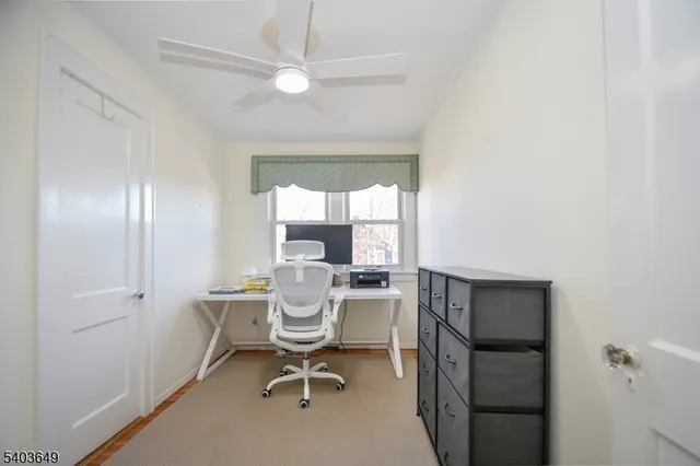 a work room with a window and furniture