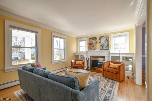a living room with furniture windows and a fireplace