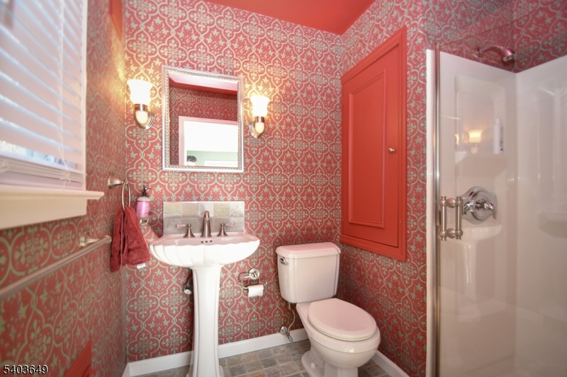11 Morris Court Summit, NJ 07901 - Photo 9 of 16 a bathroom with a sink toilet and a mirror