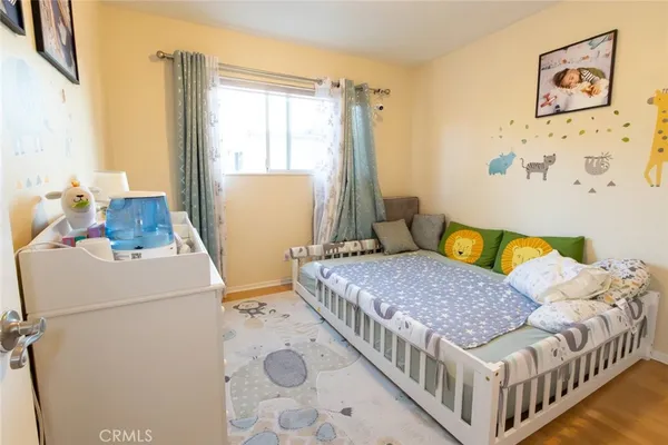 a bedroom with a bed and a table