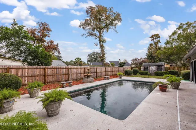 a view of a swimming pool with a patio