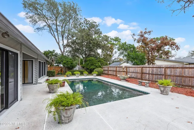 a view of a swimming pool with a patio