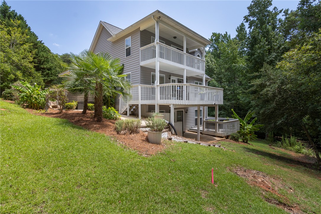 125 Inlet Pointe Drive Anderson, SC 29625 - Photo 2 of 39 Multi-level outdoor decks and balconies extend livable space into the tree-lined backyard.